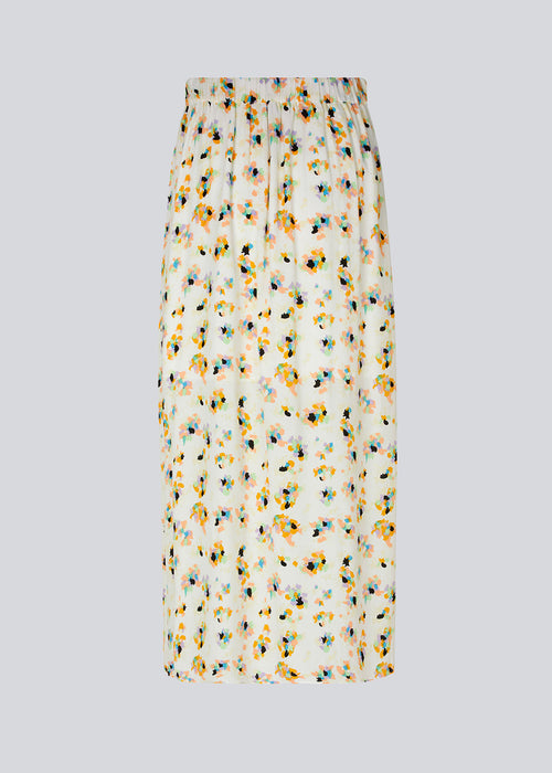Long skirt designed with an A-line silhouette with wrap detail in front. The waist is elasticated in the back with a clean look in front. DafneMD print skirt is lined. The model is 177 cm and wears a size S/36.