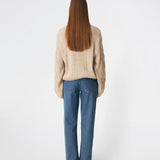 DahliaMD Cardigan is a short cardigan with a relaxed fit and round neckline. The design features a full button fastening, long sleeves and decorative knitted details at the front and along the sleeves. Style it with jeans or classic trousers for a relaxed everyday look. The model is 175 cm tall and is wearing a size S/36.