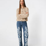 DahliaMD Cardigan is a short cardigan with a relaxed fit and round neckline. The design features a full button fastening, long sleeves and decorative knitted details at the front and along the sleeves. Style it with jeans or classic trousers for a relaxed everyday look. The model is 175 cm tall and is wearing a size S/36.