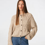 DahliaMD Cardigan is a short cardigan with a relaxed fit and round neckline. The design features a full button fastening, long sleeves and decorative knitted details at the front and along the sleeves. Style it with jeans or classic trousers for a relaxed everyday look. The model is 175 cm tall and is wearing a size S/36.