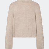 DahliaMD Cardigan is a short cardigan with a relaxed fit and round neckline. The design features a full button fastening, long sleeves and decorative knitted details at the front and along the sleeves. Style it with jeans or classic trousers for a relaxed everyday look. The model is 175 cm tall and is wearing a size S/36.