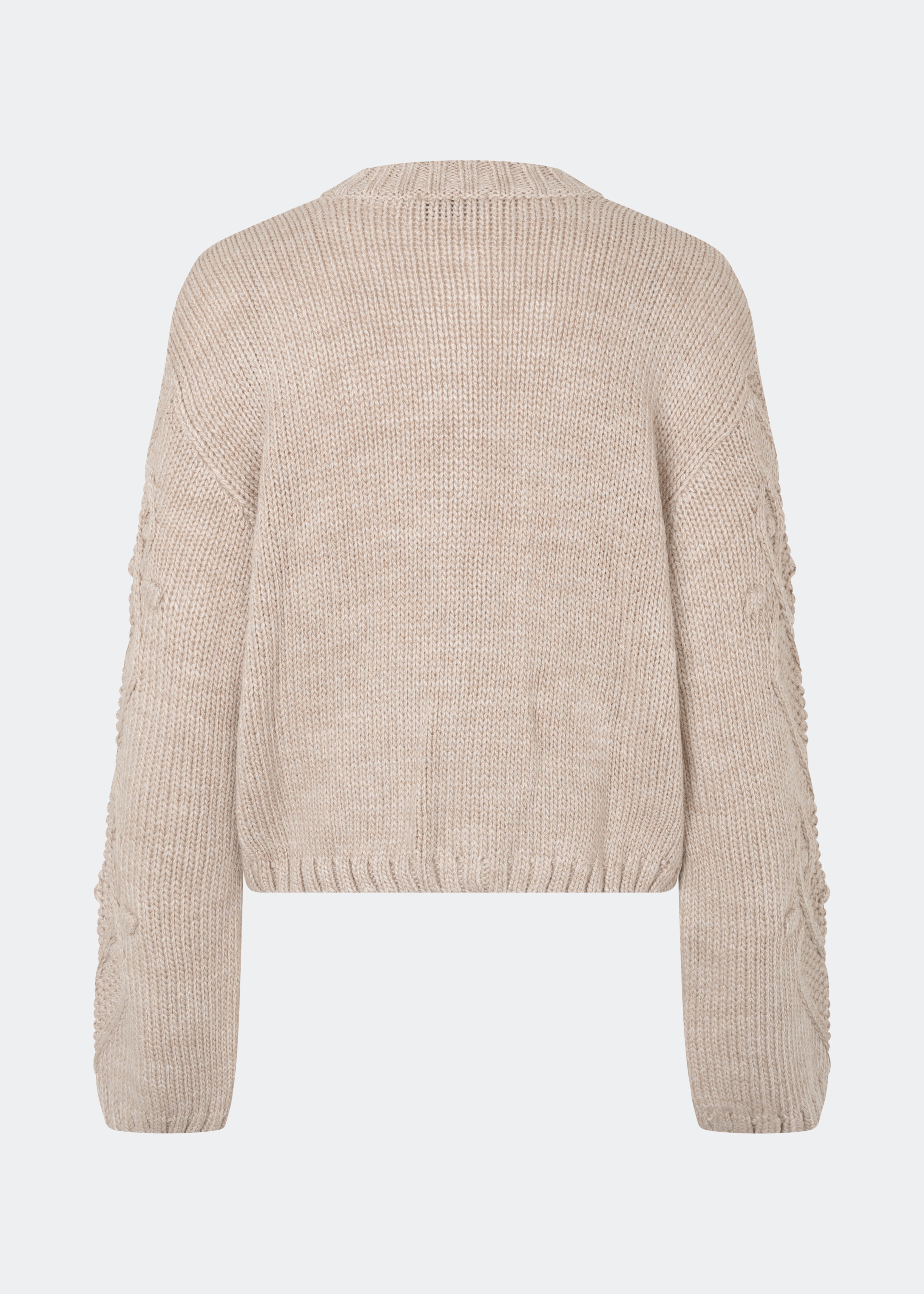 DahliaMD Cardigan is a short cardigan with a relaxed fit and round neckline. The design features a full button fastening, long sleeves and decorative knitted details at the front and along the sleeves. Style it with jeans or classic trousers for a relaxed everyday look. The model is 175 cm tall and is wearing a size S/36.
