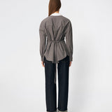 The Damarismd Shirt is a feminine checked shirt with a contrasting collar for a modern twist. Designed in a relaxed fit with a concealed button closure and an adjustable waist tie, it can be styled with a more defined silhouette. A versatile piece that works equally well for everyday wear and more polished occasions.