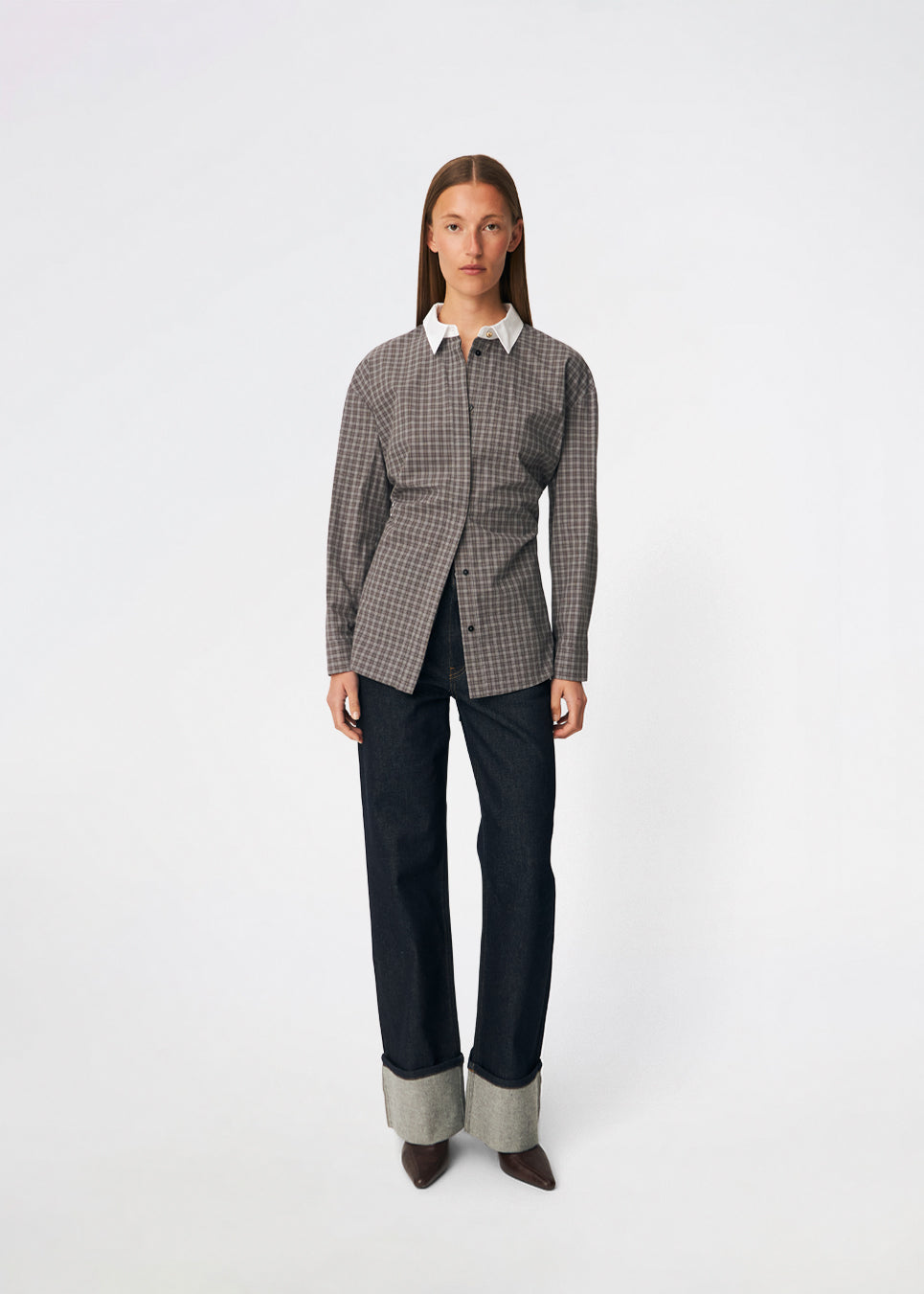 The Damarismd Shirt is a feminine checked shirt with a contrasting collar for a modern twist. Designed in a relaxed fit with a concealed button closure and an adjustable waist tie, it can be styled with a more defined silhouette. A versatile piece that works equally well for everyday wear and more polished occasions.