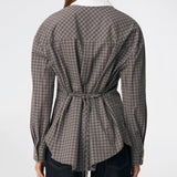 The Damarismd Shirt is a feminine checked shirt with a contrasting collar for a modern twist. Designed in a relaxed fit with a concealed button closure and an adjustable waist tie, it can be styled with a more defined silhouette. A versatile piece that works equally well for everyday wear and more polished occasions.