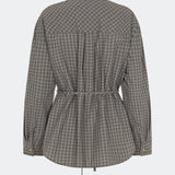 The Damarismd Shirt is a feminine checked shirt with a contrasting collar for a modern twist. Designed in a relaxed fit with a concealed button closure and an adjustable waist tie, it can be styled with a more defined silhouette. A versatile piece that works equally well for everyday wear and more polished occasions.