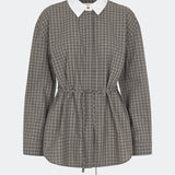 The Damarismd Shirt is a feminine checked shirt with a contrasting collar for a modern twist. Designed in a relaxed fit with a concealed button closure and an adjustable waist tie, it can be styled with a more defined silhouette. A versatile piece that works equally well for everyday wear and more polished occasions.