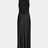 DanillaMD Dress is a long satin dress with an elegant, figure-hugging silhouette. The design features a straight neckline, thin straps and draped detailing at the side, creating a soft fall. The open back with delicate crossing straps adds a feminine touch. Style it with heels and simple accessories for special occasions. The model is 175 cm tall and is wearing a size S/36.