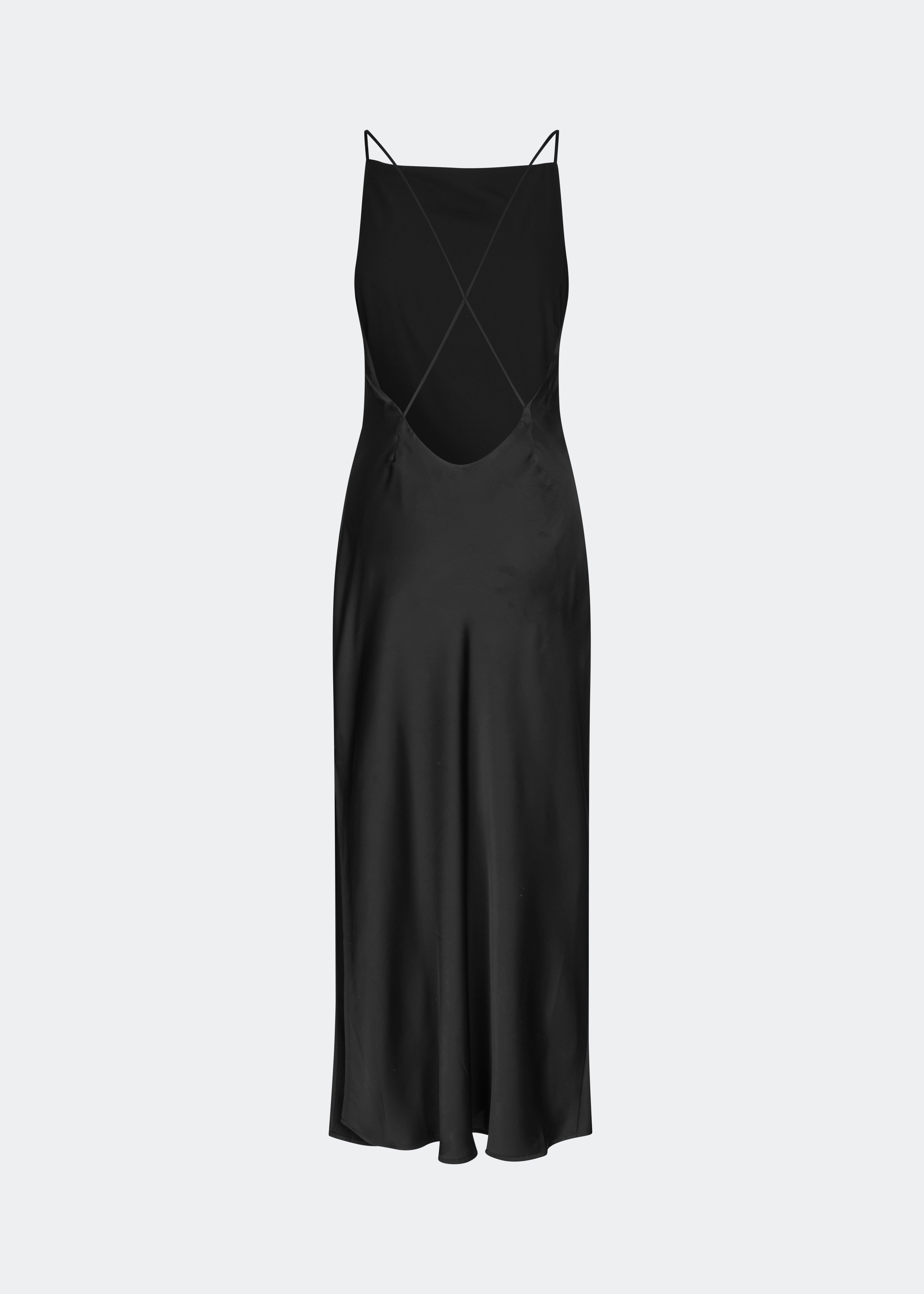 DanillaMD Dress is a long satin dress with an elegant, figure-hugging silhouette. The design features a straight neckline, thin straps and draped detailing at the side, creating a soft fall. The open back with delicate crossing straps adds a feminine touch. Style it with heels and simple accessories for special occasions. The model is 175 cm tall and is wearing a size S/36.