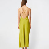 DanillaMD Dress is a long satin dress with an elegant, figure-hugging silhouette. The design features a straight neckline, thin straps and draped detailing at the side, creating a soft fall. The open back with delicate crossing straps adds a feminine touch. Style it with heels and simple accessories for special occasions. The model is 175 cm tall and is wearing a size S/36.