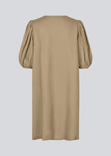 Mini dress in light brown with a loose fit and puff sleeves with elastic in the end. DarrelMD dress has an opening in the front with a button closure.