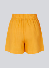 Yellow shorts in a relaxed fit, wide legs, and an elasticated waistband. DarrelMD shorts are crafted from a linen material. 
