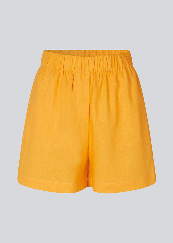 Yellow shorts in a relaxed fit, wide legs, and an elasticated waistband. DarrelMD shorts are crafted from a linen material. 