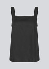 Black Top with wide straps and a loose fit. DarrelMD top has a slit in the back and is closed with three buttons.