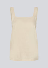 Linen top in beige with wide straps and a loose fit. DarrelMD top has a slit in the back and is closed with three buttons.