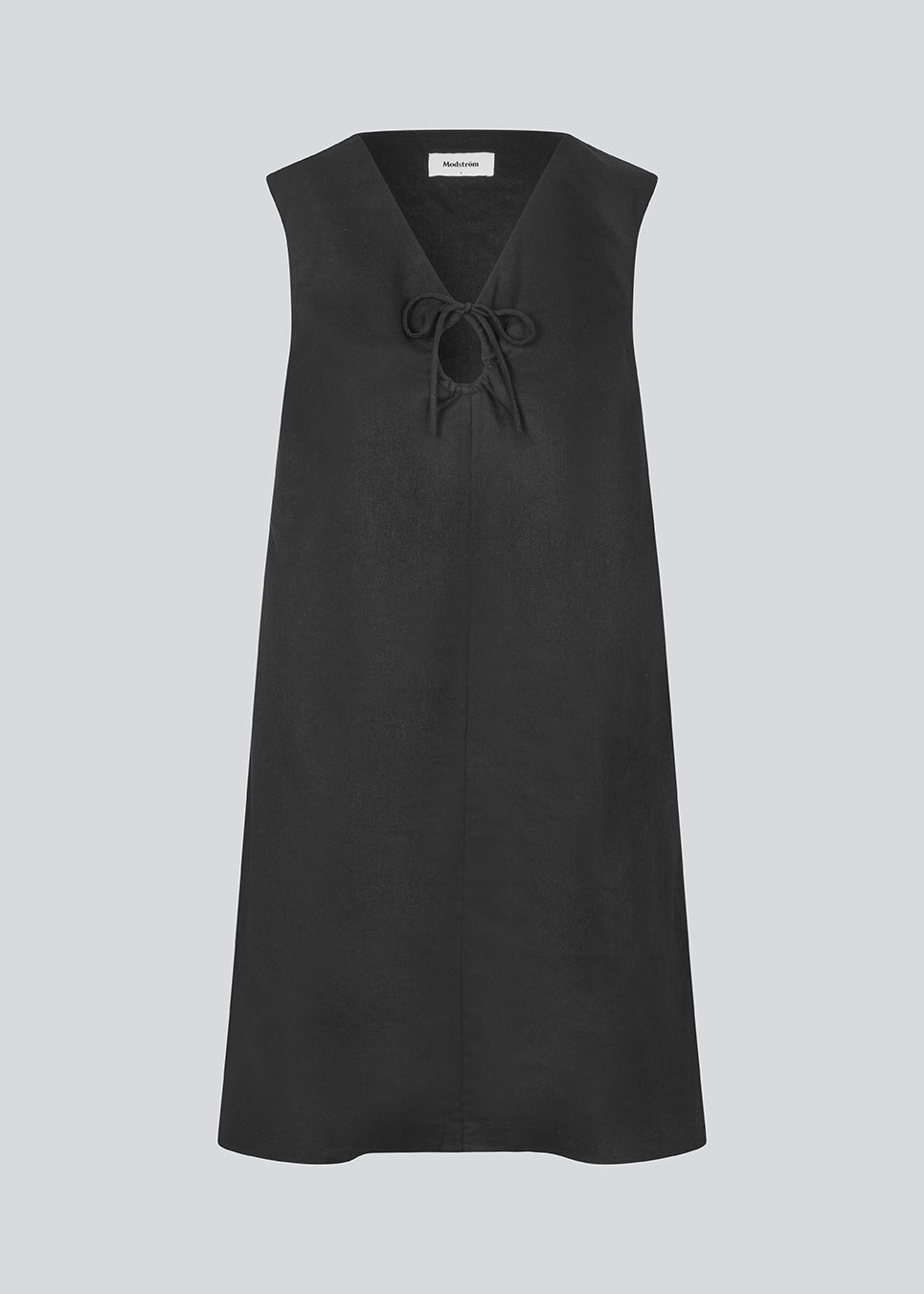 Short black linen dress with an A-line silhouette. DaynaMD dress is sleeveless, and features a deep v-neckline with cut-out details and ties. The model is 177 cm and wears a size S/36.