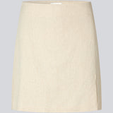 Short skirt with a medium waistline. DaynaMD skirt is made with a slim fit with wrap-over detail with a small slit in front and zipper at the side. The model is 177 cm and wears a size S/36.
