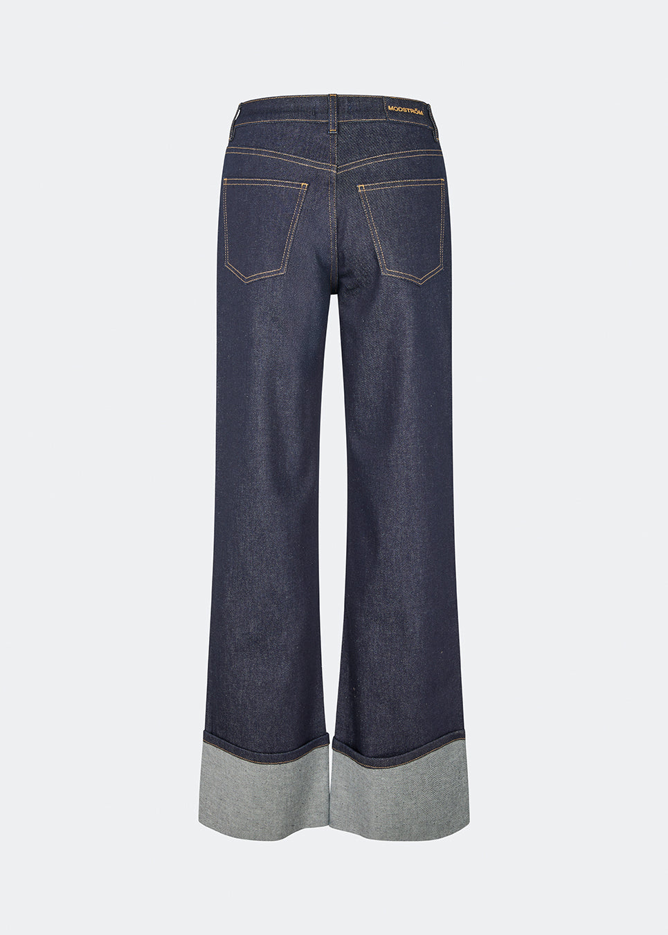 DeanieMD Jeans are high-waisted jeans with wide, straight legs. The design features a classic five-pocket construction, contrast stitching and wide turn-up cuffs at the hems. Style them with a simple T-shirt or knitwear for a relaxed everyday look. The model is 175 cm tall and is wearing a size S/36.