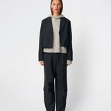 DeanneMD Pants are loose-fitting trousers with wide legs and a relaxed, modern silhouette. The trousers feature belt loops, an elasticated back waist and practical cargo pockets on the legs. Style them with a simple top or shirt for an effortless look, or pair with a blazer for a more tailored contrast. The model is 175 cm tall and is wearing a size S/36.
