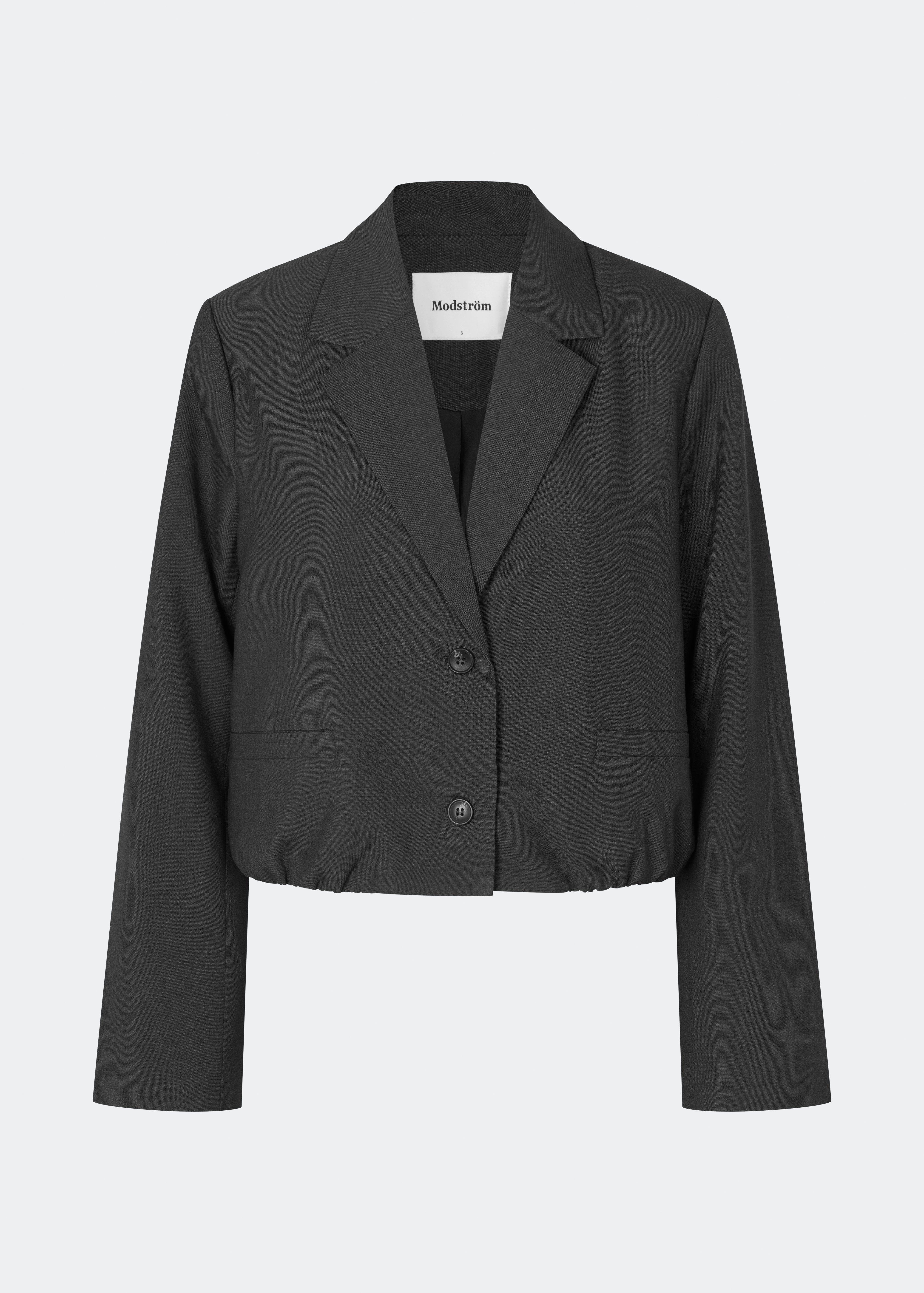 DeanneMD Blazer is a cropped blazer with a relaxed, modern silhouette. The blazer features classic lapels, long sleeves, two front buttons and an elasticated hem that adds a casual touch to the tailored design. Style it with matching trousers for a complete suit look or pair it with jeans for a more relaxed outfit. The model is 175 cm tall and is wearing a size S/36.