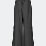 DeanneMD Pants are loose-fitting trousers with wide legs and a relaxed, modern silhouette. The trousers feature belt loops, an elasticated back waist and practical cargo pockets on the legs. Style them with a simple top or shirt for an effortless look, or pair with a blazer for a more tailored contrast. The model is 175 cm tall and is wearing a size S/36.