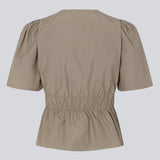 Beige top made from a cotton mix with short, slightly puffed, sleeves, and a deep v-neckline. DeenMD top has a flattering ruched detail below the chest and at the waist. The model is 177 cm and wears a size S/36.