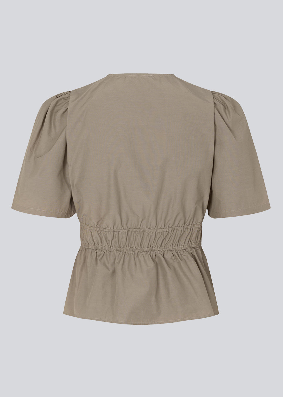 Beige top made from a cotton mix with short, slightly puffed, sleeves, and a deep v-neckline. DeenMD top has a flattering ruched detail below the chest and at the waist. The model is 177 cm and wears a size S/36.