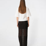 Dianamd Skirt is an elegant maxi skirt with a fitted silhouette through the hips, flowing into a sheer lace design from the knees down. The long, streamlined shape creates a feminine silhouette, while the semi-sheer finish adds a light and sophisticated touch. Style it with a simple T-shirt for an effortless everyday look or pair it with an elegant top for special occasions. The model is 175 cm tall and is wearing a size S/36.