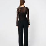 Dianamd Top is a fitted lace top with long sleeves and a sheer finish that adds a feminine and modern touch to your wardrobe. The clean silhouette makes it easy to wear on its own or layered under blazers, knitwear or dresses, allowing the delicate lace to stand out. Perfect for both everyday styling and special occasions. The model is 175 cm tall and is wearing a size S/36.