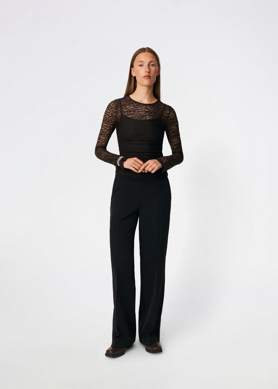 Dianamd Top is a fitted lace top with long sleeves and a sheer finish that adds a feminine and modern touch to your wardrobe. The clean silhouette makes it easy to wear on its own or layered under blazers, knitwear or dresses, allowing the delicate lace to stand out. Perfect for both everyday styling and special occasions. The model is 175 cm tall and is wearing a size S/36.