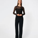 Dianamd Top is a fitted lace top with long sleeves and a sheer finish that adds a feminine and modern touch to your wardrobe. The clean silhouette makes it easy to wear on its own or layered under blazers, knitwear or dresses, allowing the delicate lace to stand out. Perfect for both everyday styling and special occasions. The model is 175 cm tall and is wearing a size S/36.