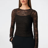 Dianamd Top is a fitted lace top with long sleeves and a sheer finish that adds a feminine and modern touch to your wardrobe. The clean silhouette makes it easy to wear on its own or layered under blazers, knitwear or dresses, allowing the delicate lace to stand out. Perfect for both everyday styling and special occasions. The model is 175 cm tall and is wearing a size S/36.