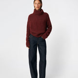 The Dictemd Rollneck is a soft knit sweater featuring a high roll neck and a relaxed fit. Ribbed trims and a subtle side slit add a modern touch, while the melange knit provides warmth and texture. A versatile wardrobe staple, perfect worn on its own or layered under seasonal jackets and coats.