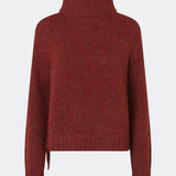 The Dictemd Rollneck is a soft knit sweater featuring a high roll neck and a relaxed fit. Ribbed trims and a subtle side slit add a modern touch, while the melange knit provides warmth and texture. A versatile wardrobe staple, perfect worn on its own or layered under seasonal jackets and coats.