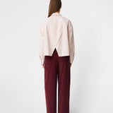 The Dilanmd Stripe Shirt is a classic striped shirt with a relaxed oversized fit. Designed with a traditional collar, button closure, and wide cuffs, it is finished with a distinctive overlapping back slit that adds a modern twist. A versatile wardrobe staple that can be worn on its own or layered effortlessly over everyday essentials.