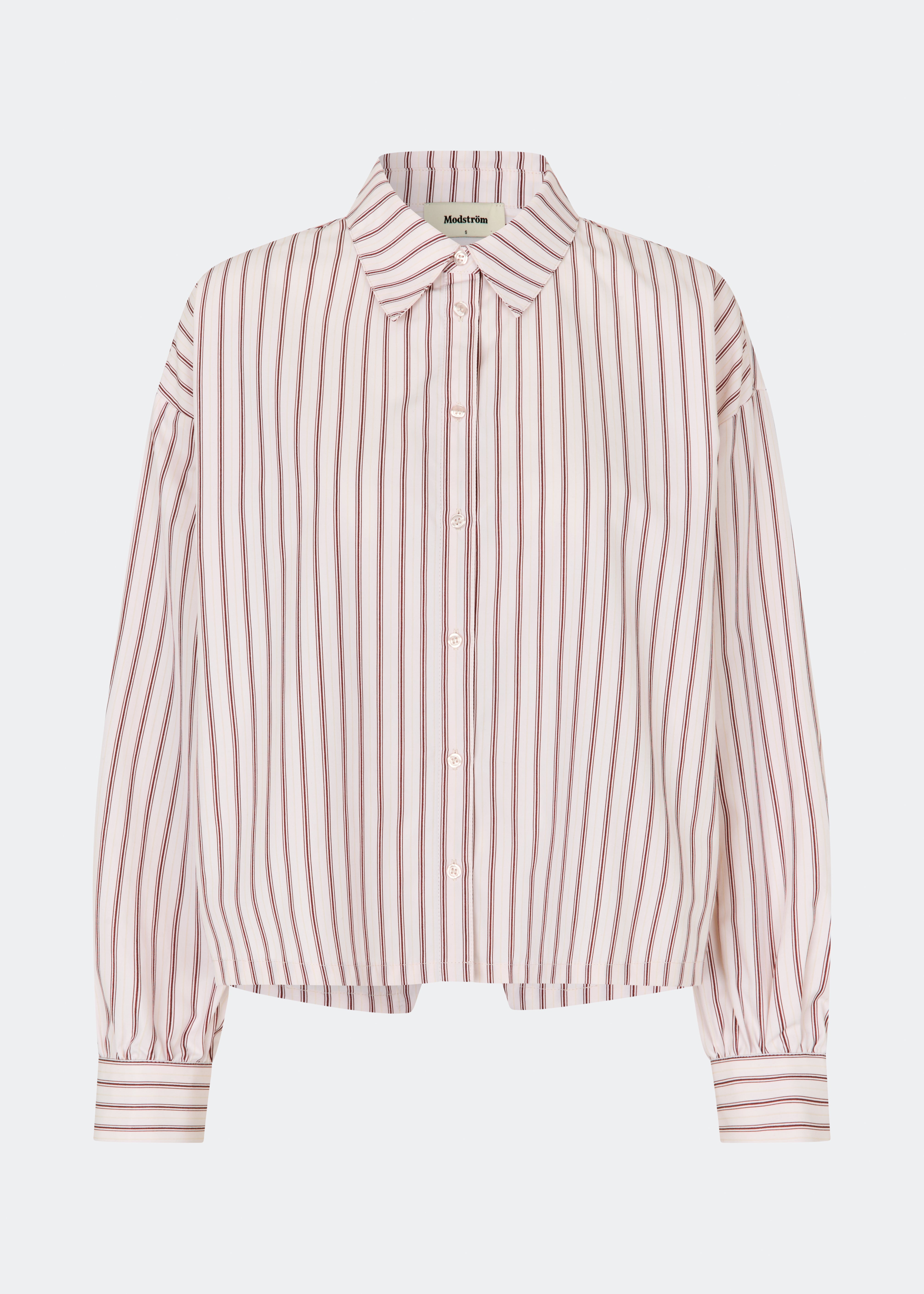 The Dilanmd Stripe Shirt is a classic striped shirt with a relaxed oversized fit. Designed with a traditional collar, button closure, and wide cuffs, it is finished with a distinctive overlapping back slit that adds a modern twist. A versatile wardrobe staple that can be worn on its own or layered effortlessly over everyday essentials.