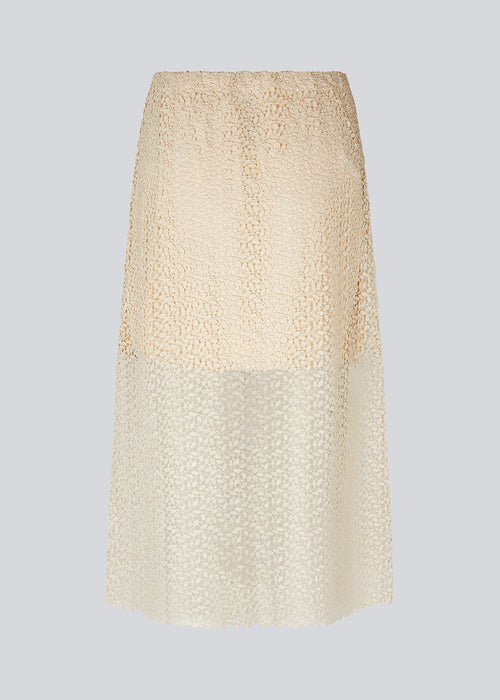 Skirt in an A-silhouette made from an elegant lace material, that is slightly transparent. DionaMD skirt features a fabric covered elastic waist. Lined. The model is 177 cm and wears a size S/36.