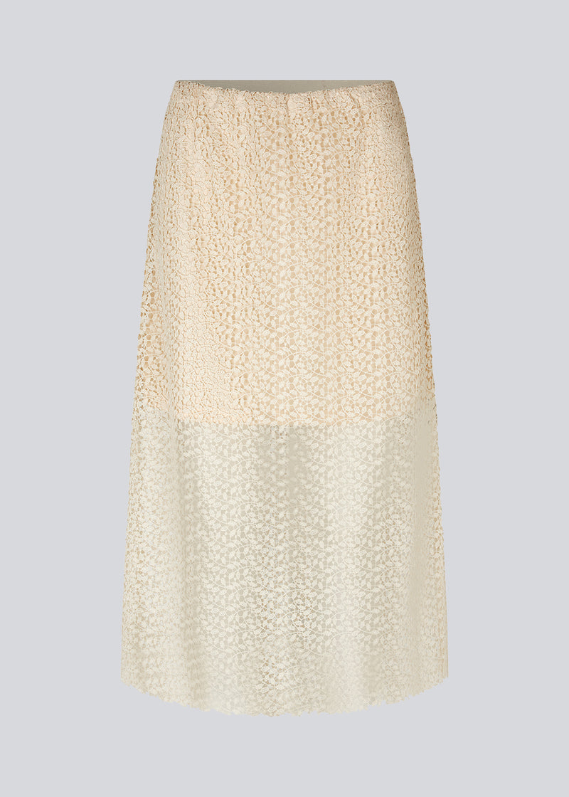 Skirt in an A-silhouette made from an elegant lace material, that is slightly transparent. DionaMD skirt features a fabric covered elastic waist. Lined. The model is 177 cm and wears a size S/36.