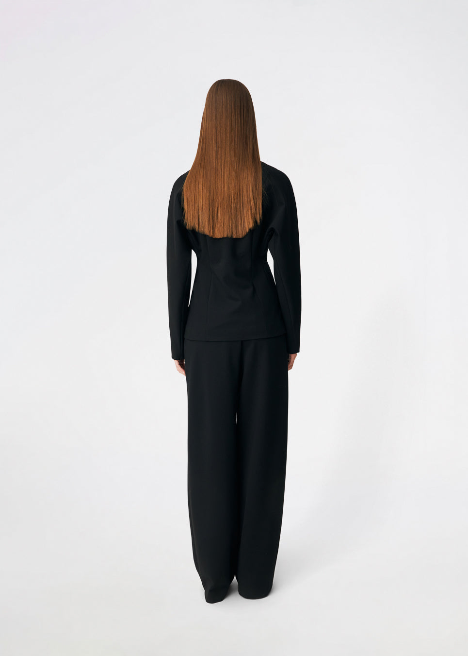 The Doritmd Blazer is a feminine tailored blazer with a clean collarless neckline and a fitted silhouette. Sculptural gold-tone buttons add a refined statement, while the shaped panels accentuate the waist for a flattering fit. Wear it with the matching trousers or layer it over a dress for a modern, sophisticated look.