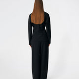The Doritmd Blazer is a feminine tailored blazer with a clean collarless neckline and a fitted silhouette. Sculptural gold-tone buttons add a refined statement, while the shaped panels accentuate the waist for a flattering fit. Wear it with the matching trousers or layer it over a dress for a modern, sophisticated look.