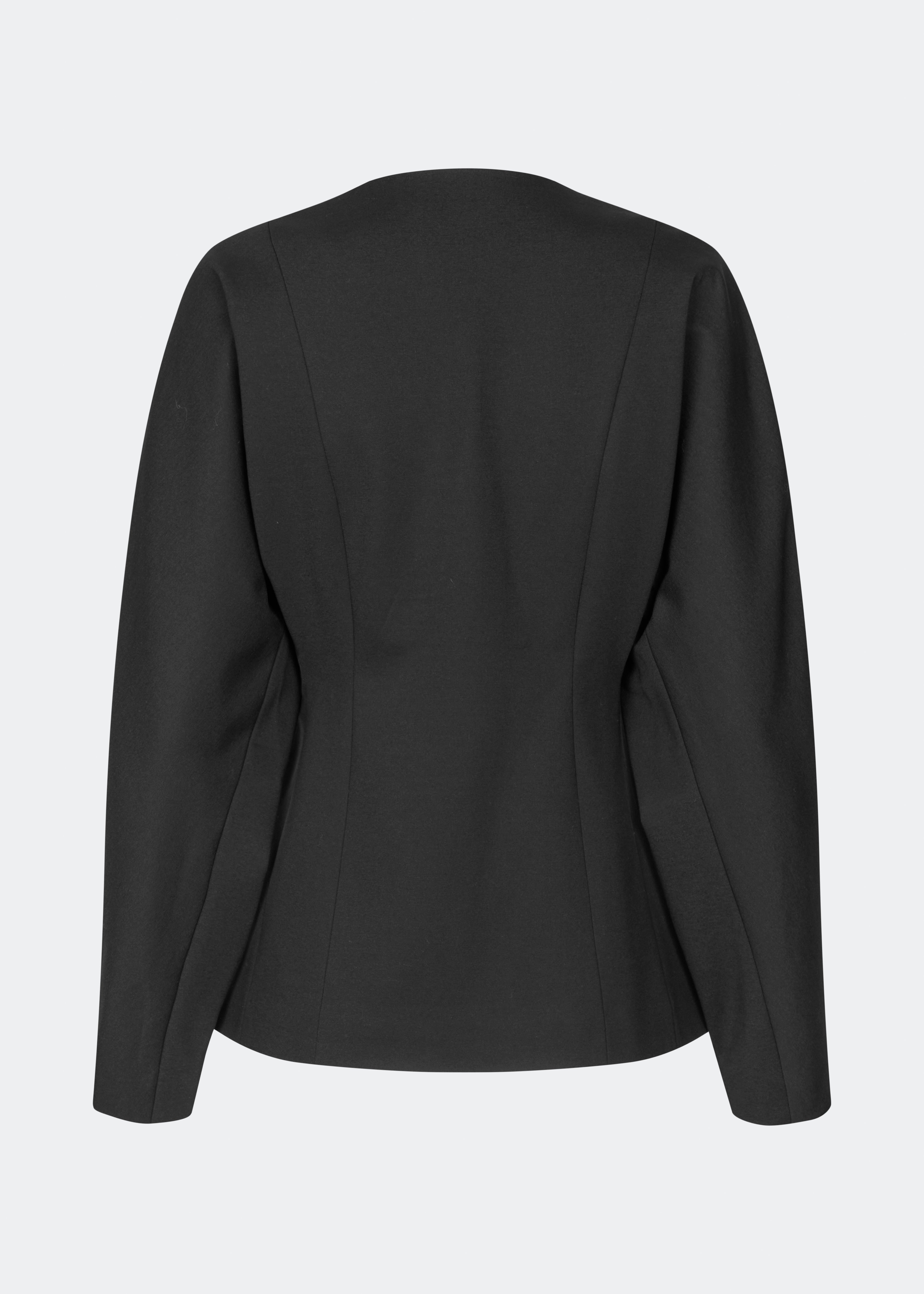 The Doritmd Blazer is a feminine tailored blazer with a clean collarless neckline and a fitted silhouette. Sculptural gold-tone buttons add a refined statement, while the shaped panels accentuate the waist for a flattering fit. Wear it with the matching trousers or layer it over a dress for a modern, sophisticated look.