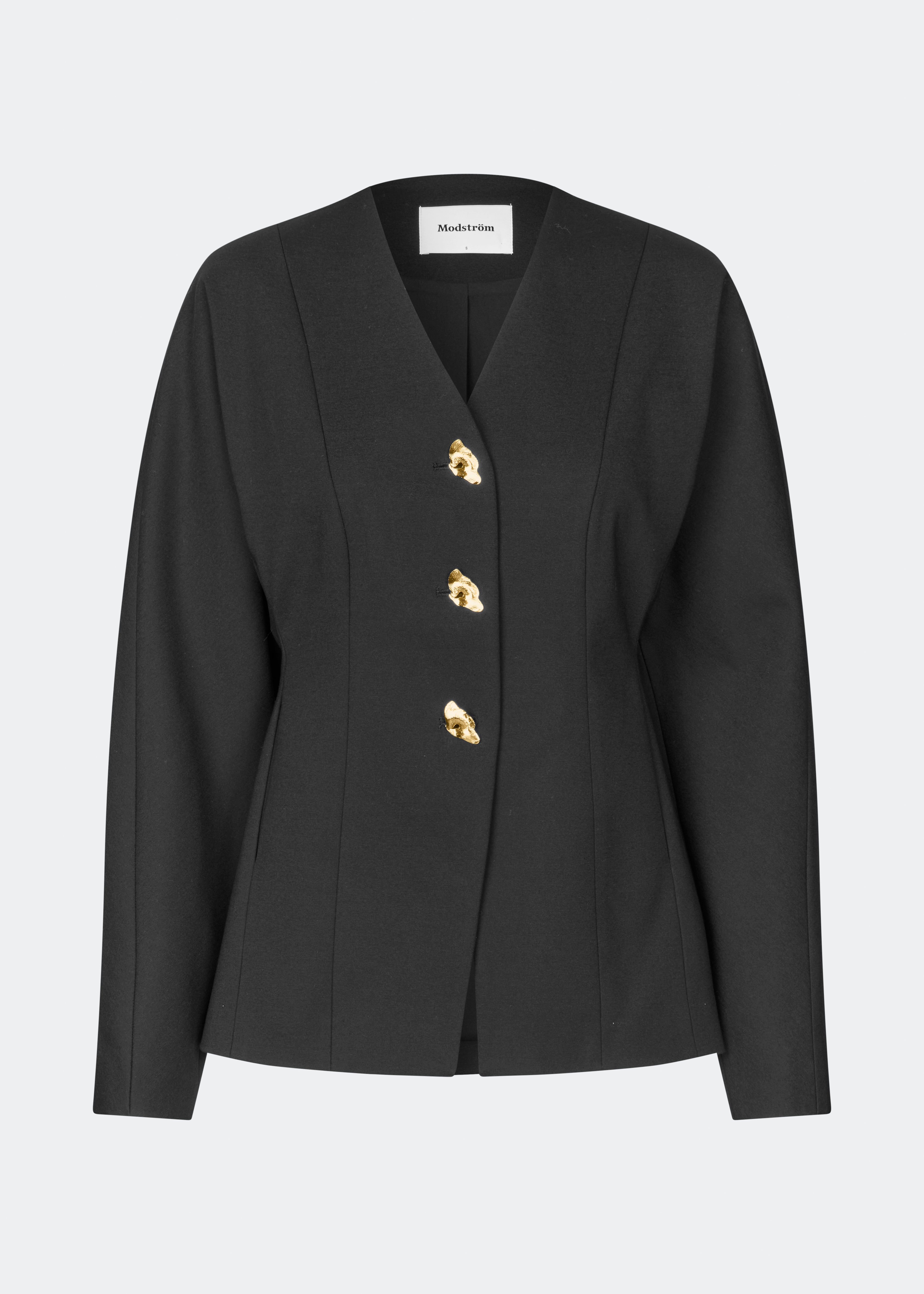 The Doritmd Blazer is a feminine tailored blazer with a clean collarless neckline and a fitted silhouette. Sculptural gold-tone buttons add a refined statement, while the shaped panels accentuate the waist for a flattering fit. Wear it with the matching trousers or layer it over a dress for a modern, sophisticated look.
