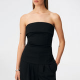 The Doritmd Top is an elegant strapless top with a fitted silhouette and a distinctive fold-over neckline for a modern, sophisticated look. Shaped seams create a flattering fit, while the concealed back zip ensures a clean finish. Pair it with the matching Doritmd Pants or a skirt for everything from elevated everyday dressing to evening occasions.