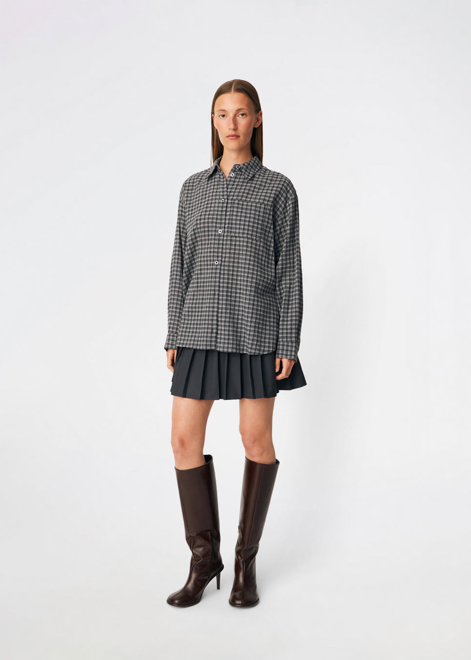 Classic shirt with a timeless checked pattern. Dorotheamd shirt is designed in a relaxed, slightly oversized silhouette with a classic collar, button-front closure, and a chest pocket. Long sleeves with buttoned cuffs complete the laid-back look. A versatile wardrobe staple that can be worn buttoned up with jeans or styled open over a T-shirt or tank top.