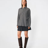 Classic shirt with a timeless checked pattern. Dorotheamd shirt is designed in a relaxed, slightly oversized silhouette with a classic collar, button-front closure, and a chest pocket. Long sleeves with buttoned cuffs complete the laid-back look. A versatile wardrobe staple that can be worn buttoned up with jeans or styled open over a T-shirt or tank top.