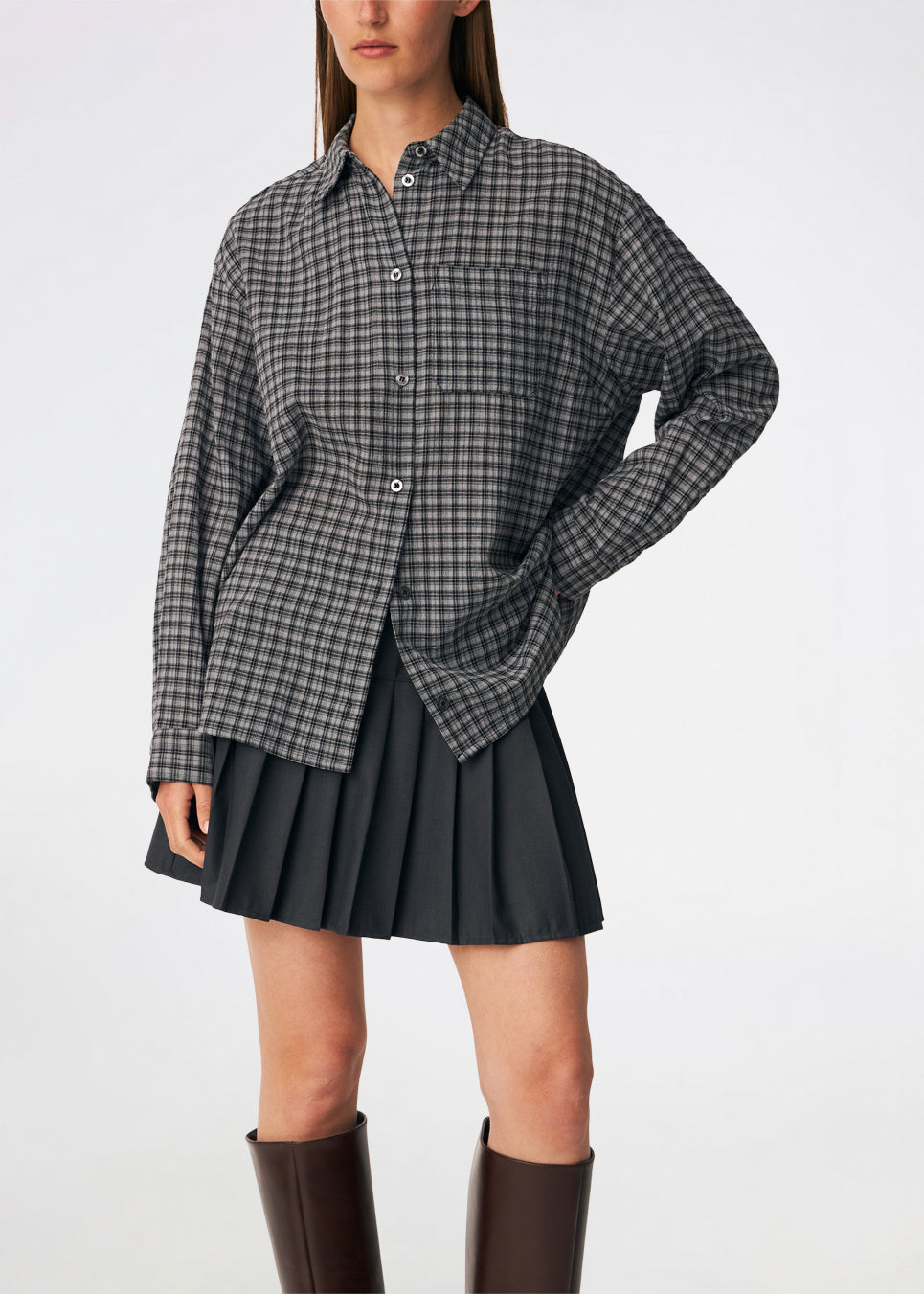 Classic shirt with a timeless checked pattern. Dorotheamd shirt is designed in a relaxed, slightly oversized silhouette with a classic collar, button-front closure, and a chest pocket. Long sleeves with buttoned cuffs complete the laid-back look. A versatile wardrobe staple that can be worn buttoned up with jeans or styled open over a T-shirt or tank top.