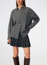 Classic shirt with a timeless checked pattern. Dorotheamd shirt is designed in a relaxed, slightly oversized silhouette with a classic collar, button-front closure, and a chest pocket. Long sleeves with buttoned cuffs complete the laid-back look. A versatile wardrobe staple that can be worn buttoned up with jeans or styled open over a T-shirt or tank top.