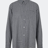Classic shirt with a timeless checked pattern. Dorotheamd shirt is designed in a relaxed, slightly oversized silhouette with a classic collar, button-front closure, and a chest pocket. Long sleeves with buttoned cuffs complete the laid-back look. A versatile wardrobe staple that can be worn buttoned up with jeans or styled open over a T-shirt or tank top.