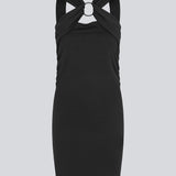 Short fitted black dress in an elastic material. EmiliaMD dress has a cool detailed metal ring at the chest and wide straps.