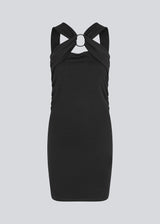 Short fitted black dress in an elastic material. EmiliaMD dress has a cool detailed metal ring at the chest and wide straps.